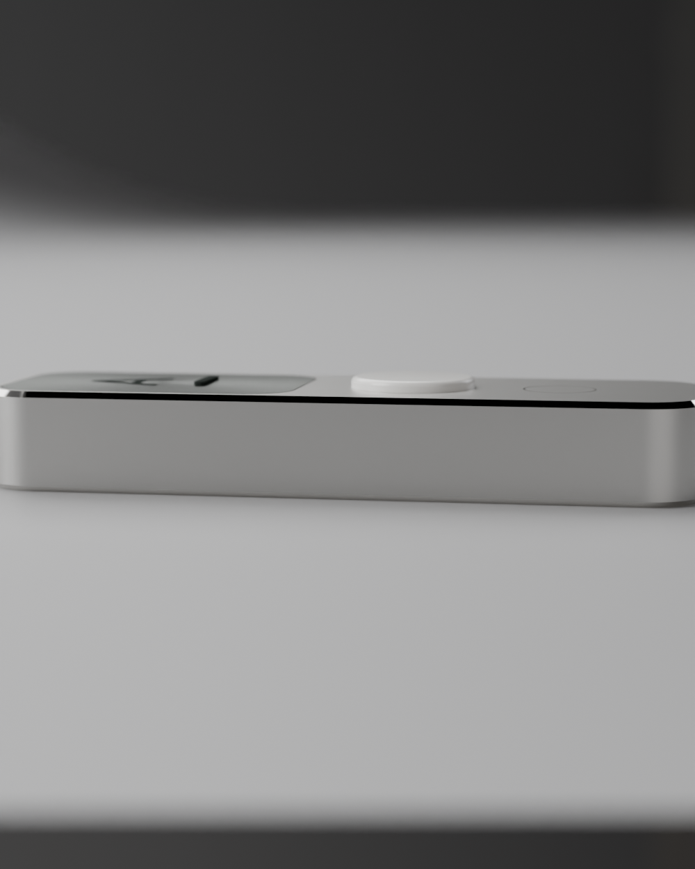 Low edge-on view of the 10 mm thick slab, showing the polished chamfer as a bright hairline between the bead-blasted face and side